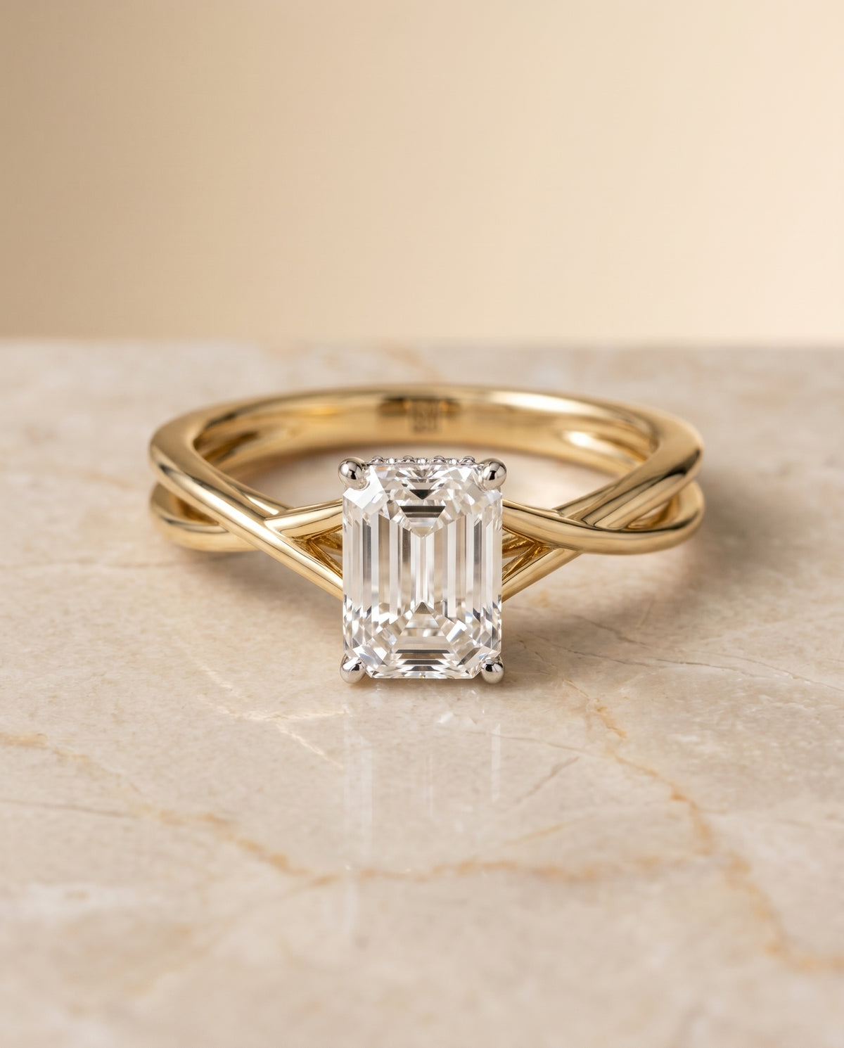 The Blondie Twisted Hidden Halo Solitaire Engagement Ring Setting for Emerald Cut Diamonds in 18K Yellow Gold | RockHer