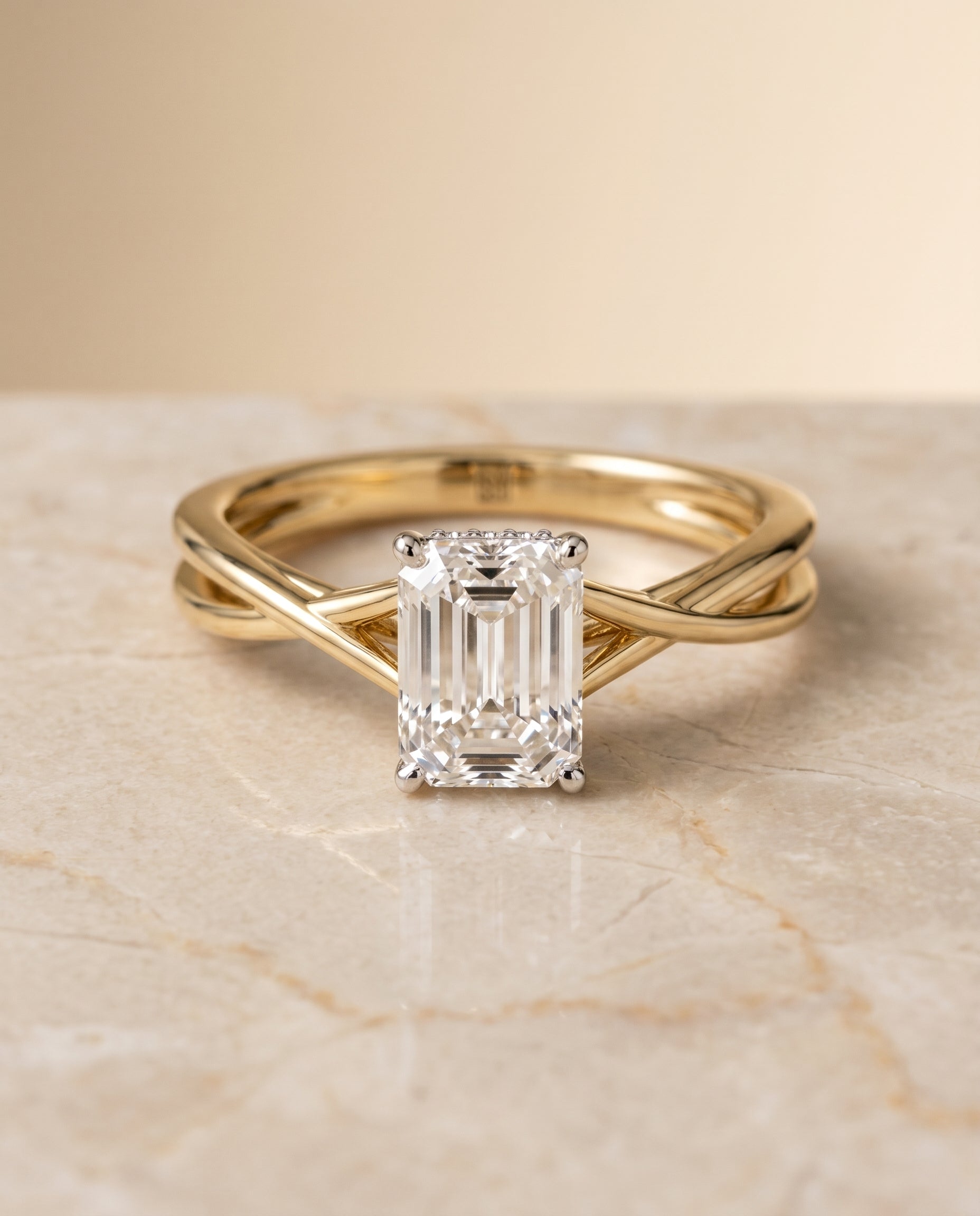 Blondie Select Twisted Shank Double Hidden Halo Solitaire Emerald Cut in 14K Yel – view 1