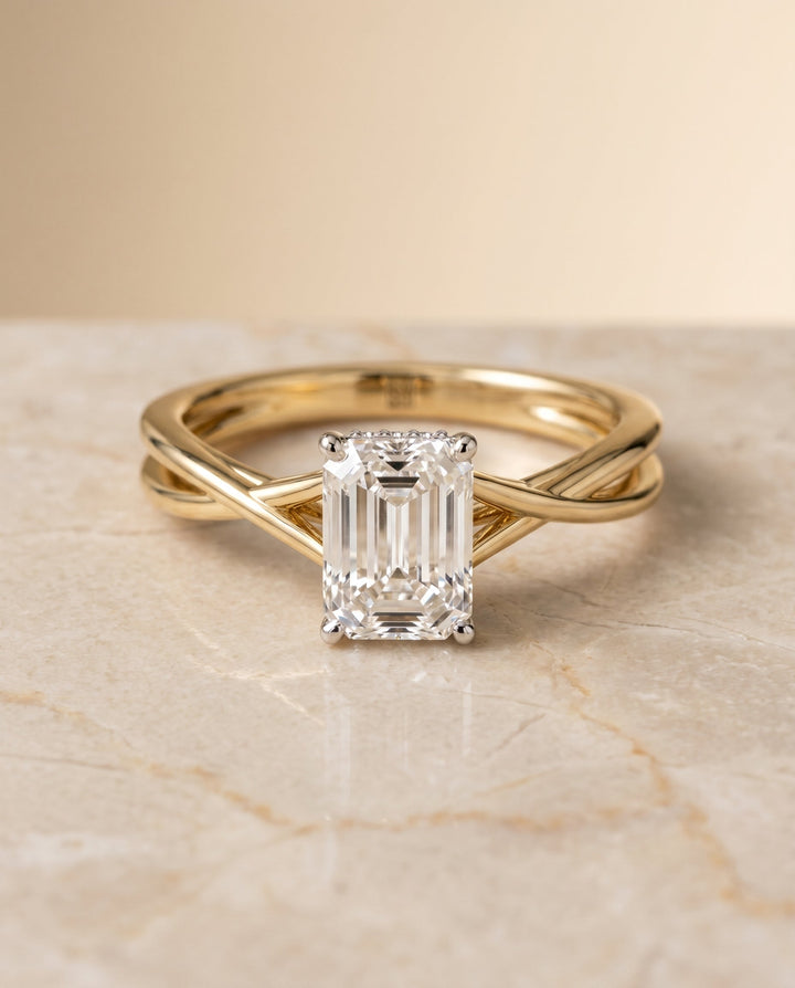Blondie Select Twisted Shank Double Hidden Halo Solitaire Emerald Cut in 14K Yel – view 1
