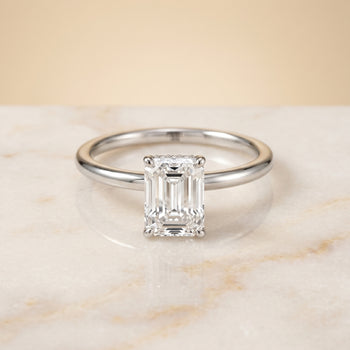 The Dolly Double Hidden Halo Solitaire Emerald Cut Engagement Ring Setting in Platinum