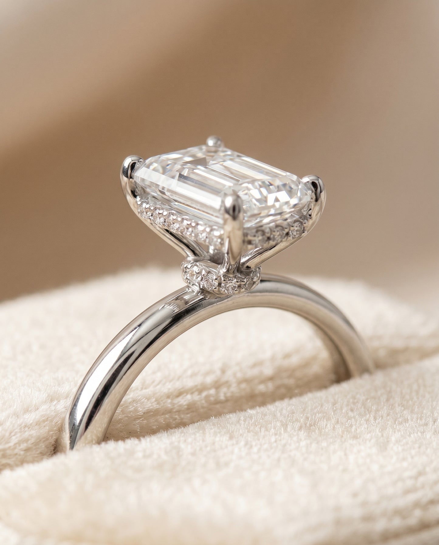 The Dolly Hidden Halo Solitaire Engagement Ring Setting for Emerald Cut Diamonds in Platinum
