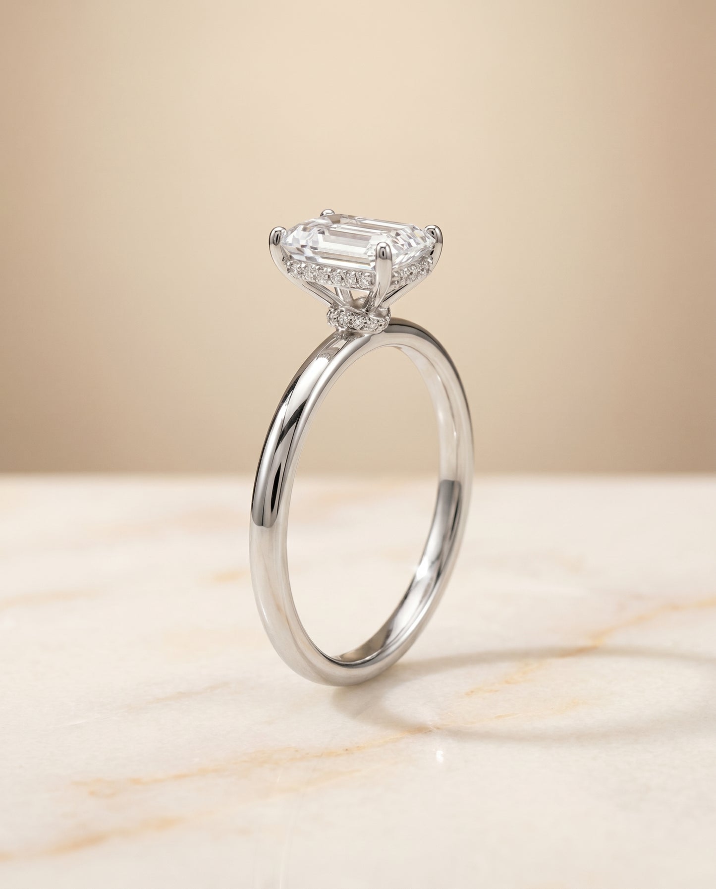 The Dolly Hidden Halo Solitaire Engagement Ring Setting for Emerald Cut Diamonds in Platinum