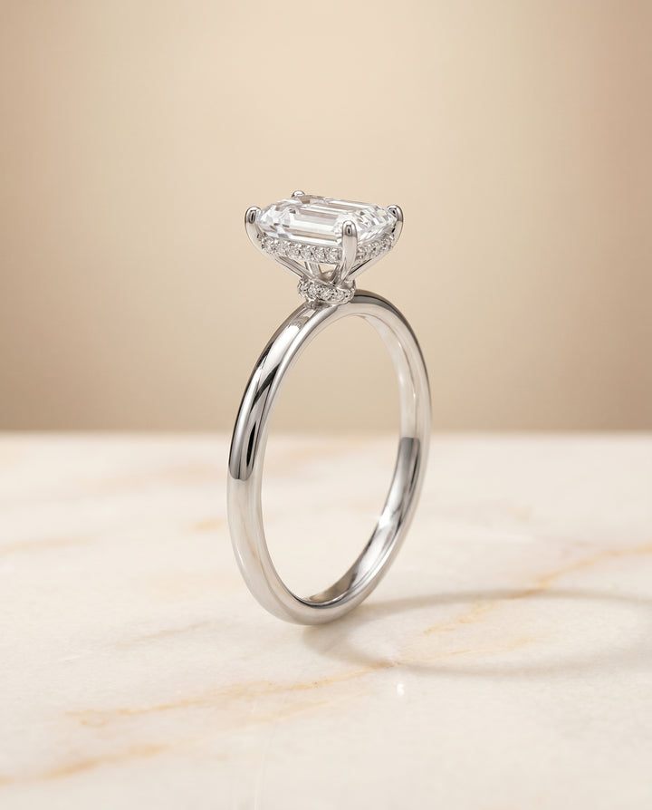 The Dolly Hidden Halo Solitaire Engagement Ring Setting for Emerald Cut Diamonds in Platinum