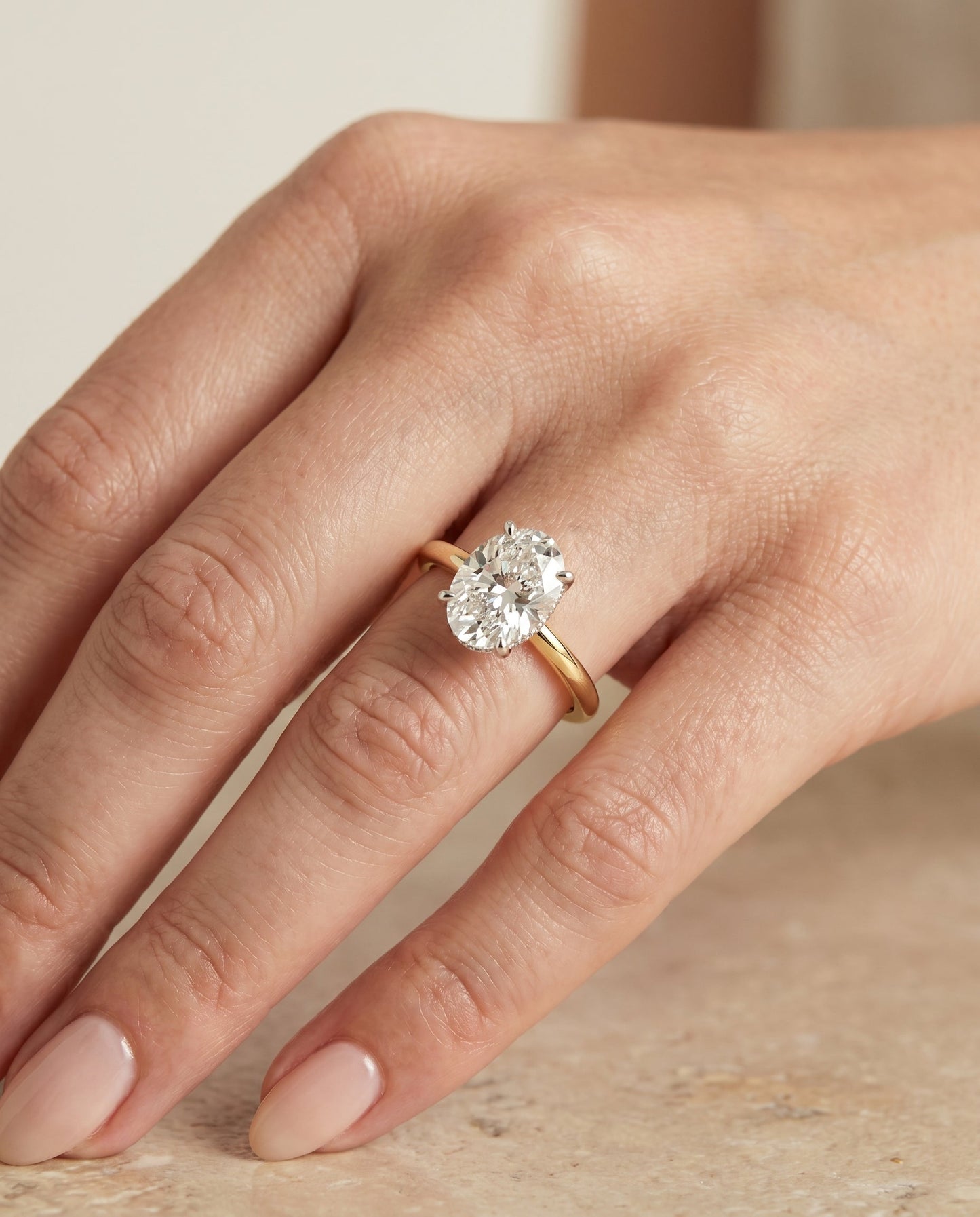 Dolly Select Double Hidden Halo Solitaire Oval Lab Diamond Engagement Ring in 18K Yellow Gold, shown on hand, angled | RockHer
