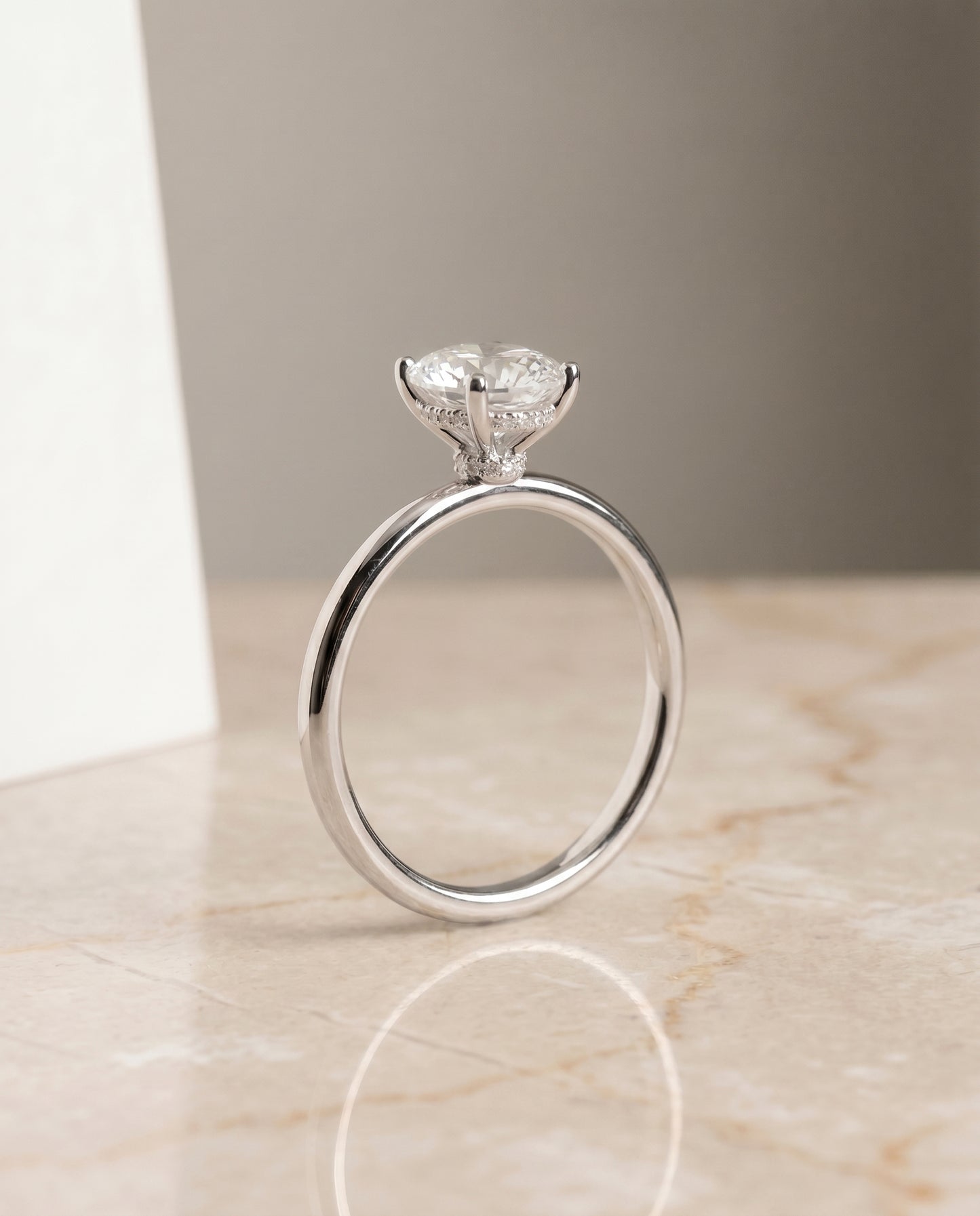 The Dolly Hidden Halo Solitaire Engagement Ring Setting for Oval Diamonds in Platinum