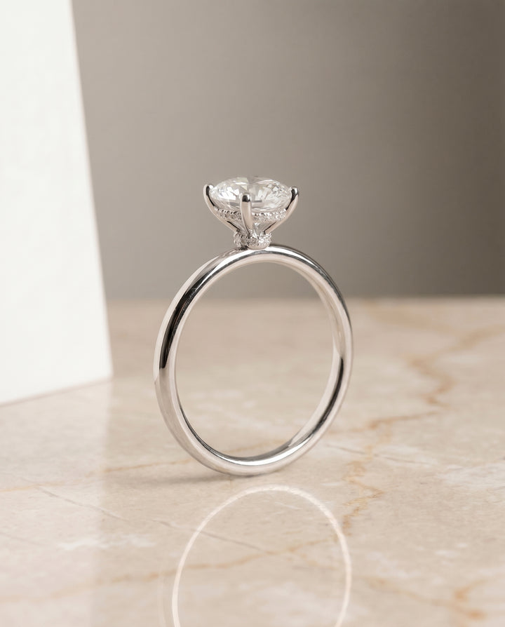The Dolly Hidden Halo Solitaire Engagement Ring Setting for Oval Diamonds in Platinum