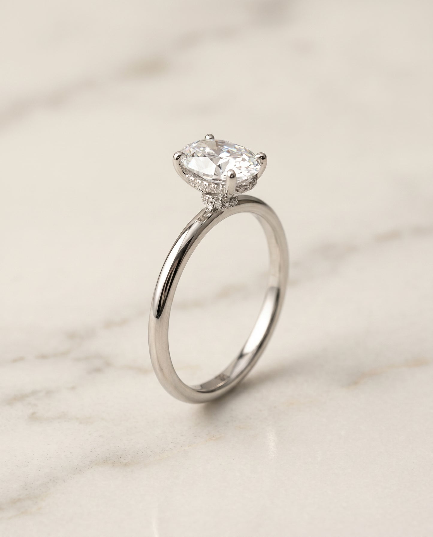 The Dolly Hidden Halo Solitaire Engagement Ring Setting for Oval Diamonds in 18K White Gold | RockHer
