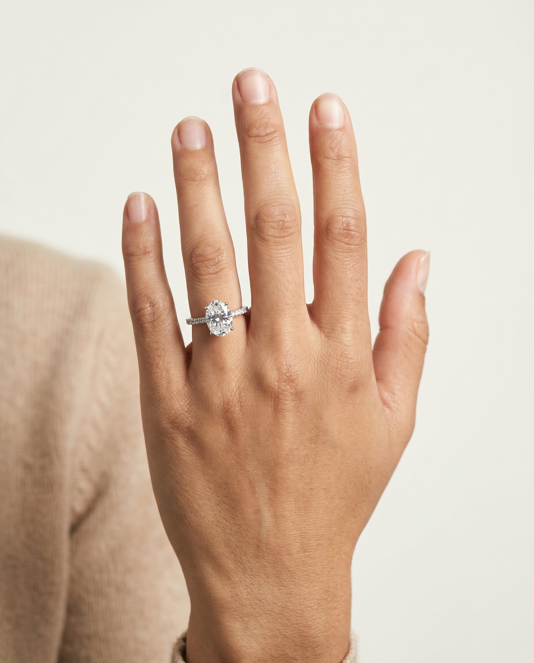 Abbey Select Hidden Halo Pavé Oval Lab Diamond Engagement Ring in Platinum, shown on hand | RockHer