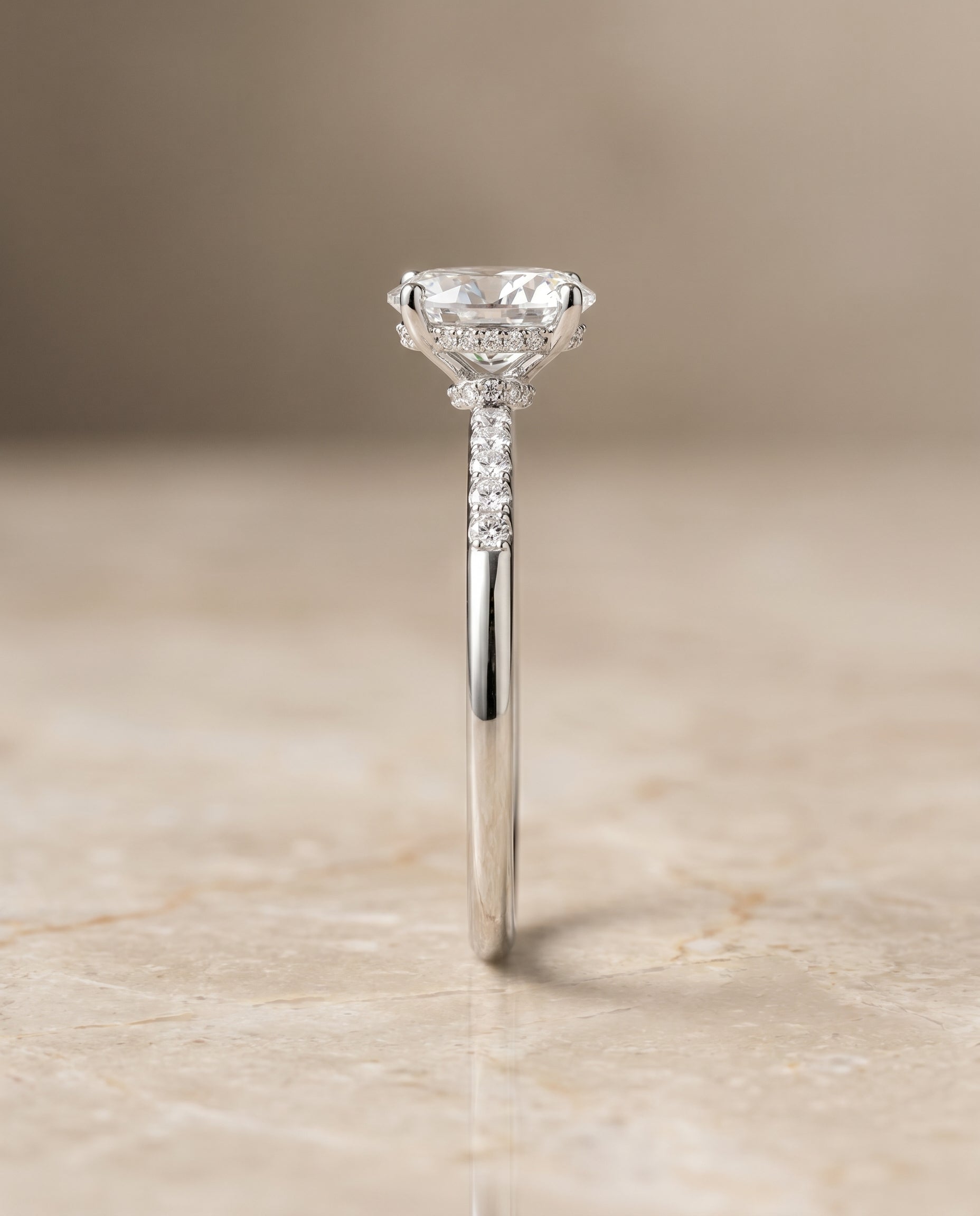 The Abbey hidden halo pavé engagement ring setting, shown in Platinum | RockHer