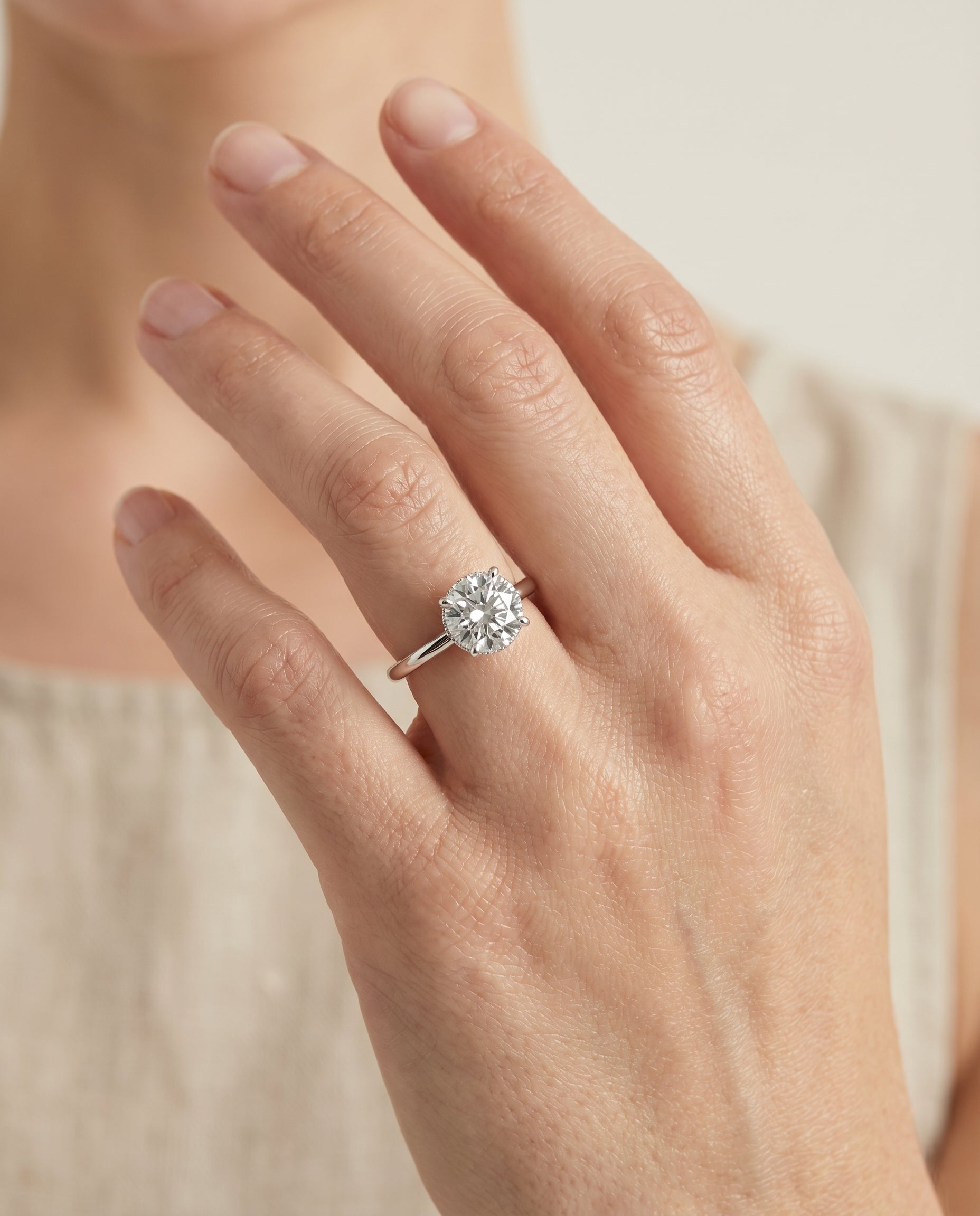 Dolly Select Double Hidden Halo Solitaire Round Lab Diamond Engagement Ring in 18K White Gold, shown on hand | RockHer