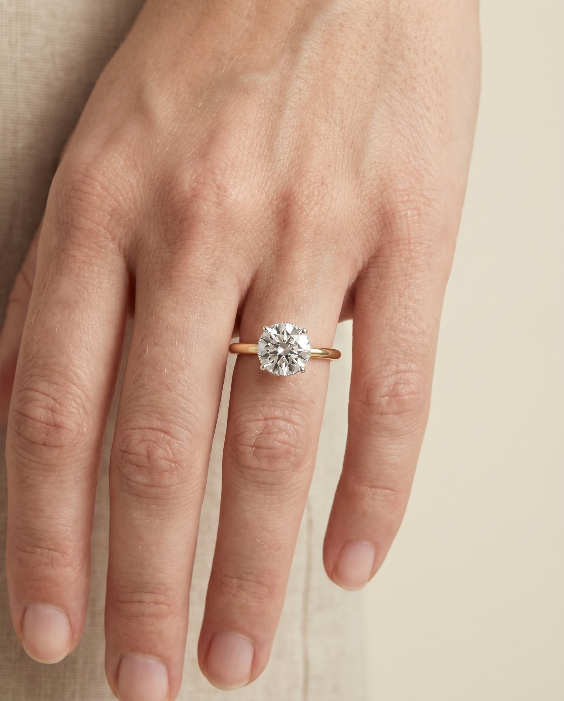 The Dolly setting for round diamonds, made to order in 18K Yellow Gold | RockHer