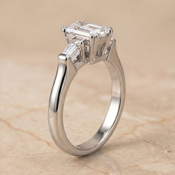 The Lily Double Prong Three Stone Emerald Cut Engagement Ring Setting in Platinum