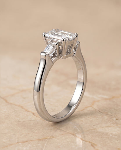 European Cut, Double Prong Tapered Baguette Three Stone Emerald, in Platinum – front view | RockHer