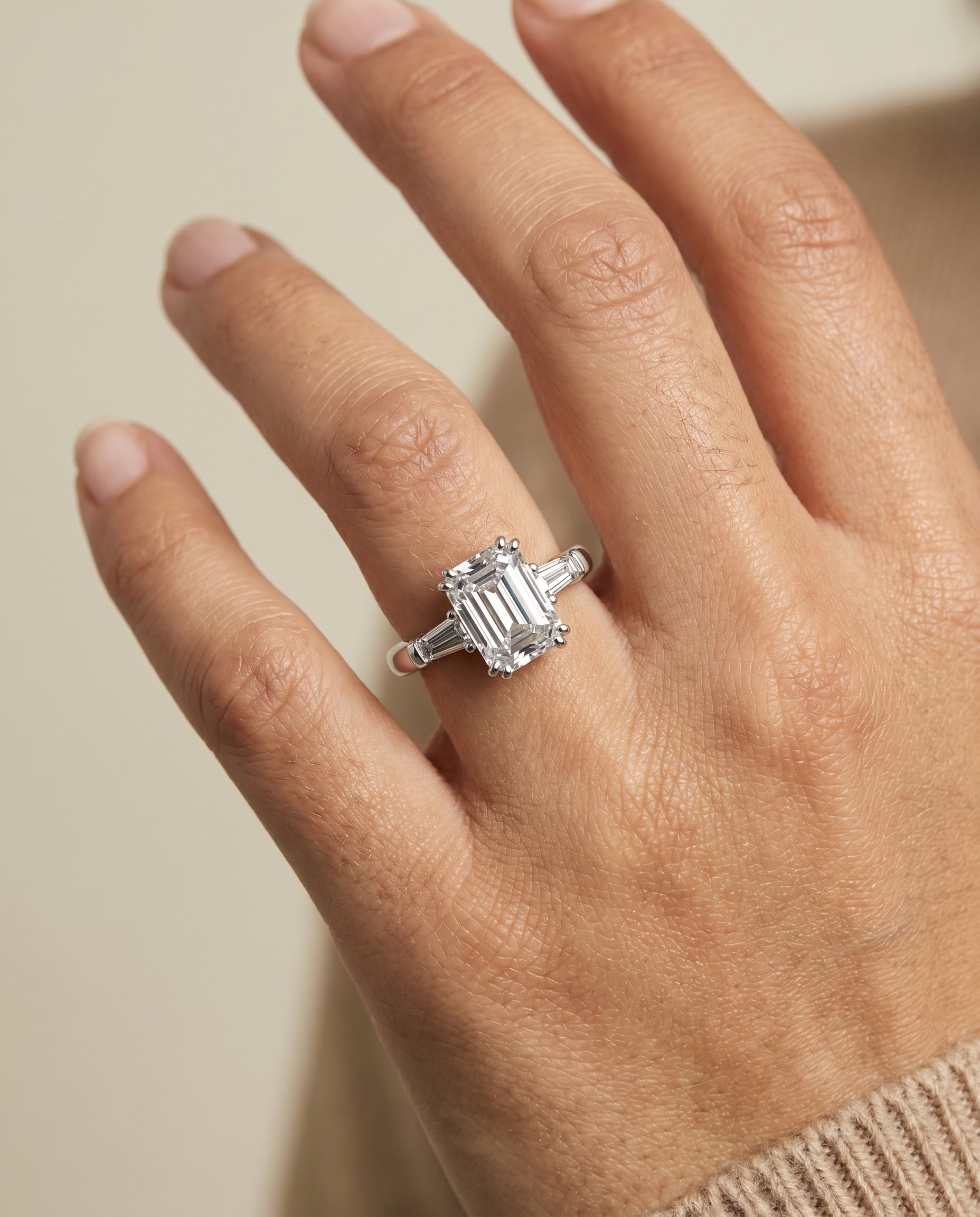 Lily Select Double Prong Three Stone Emerald Cut Lab Diamond Engagement Ring in 18K White Gold, shown on hand | RockHer