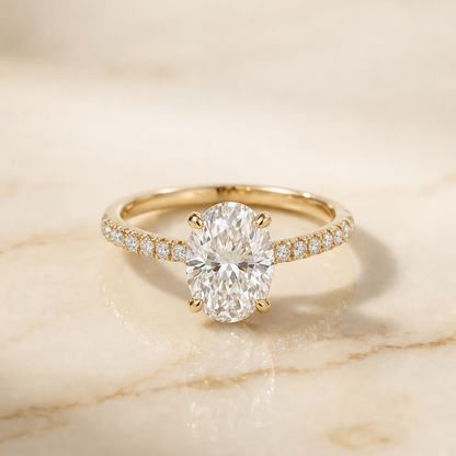 The Donna Cathedral French Pavé Solitaire Oval Engagement Ring Setting in 18K Yellow Gold