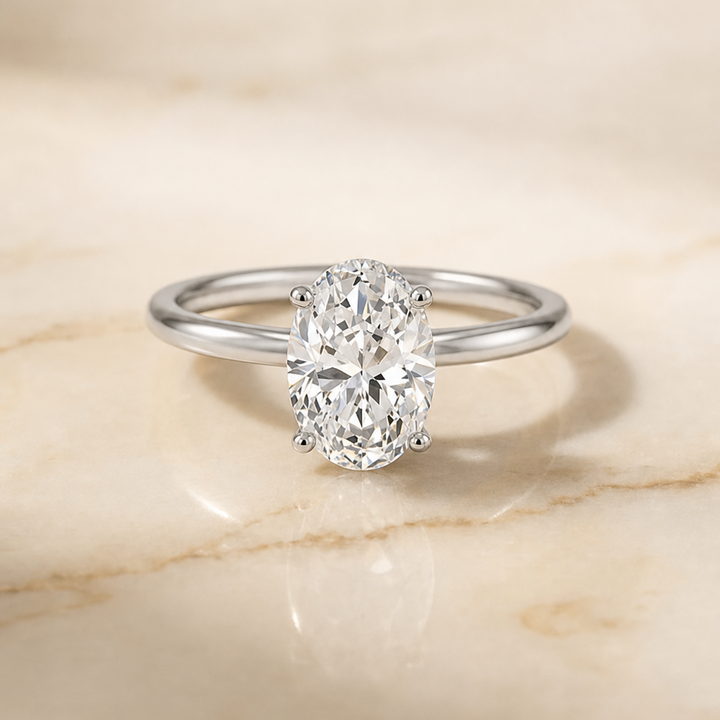The Cyndi Curved Hidden Halo Solitaire Oval Engagement Ring Setting in Platinum