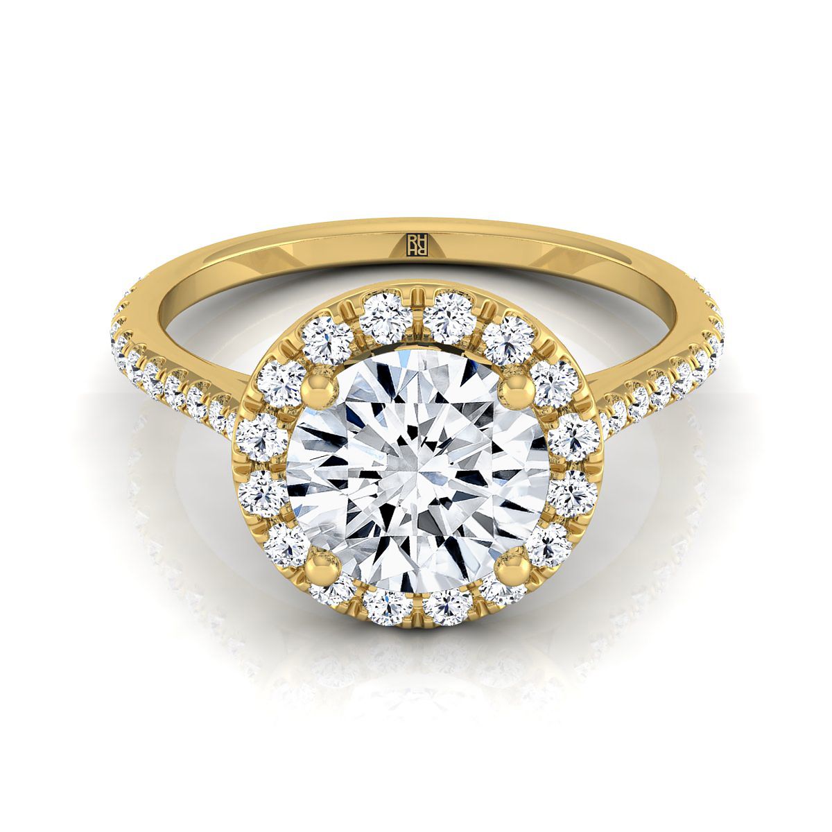 The Dionne round setting in 18K Yellow Gold, a select diamond pavé halo design from RockHer