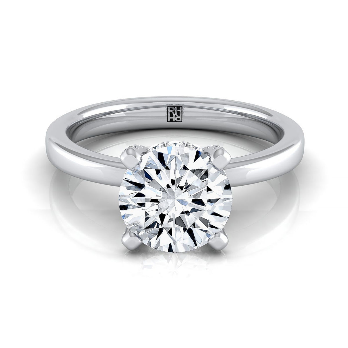 The Lana round setting in 18K White Gold, a select secret halo adorned prong solitaire design from RockHer