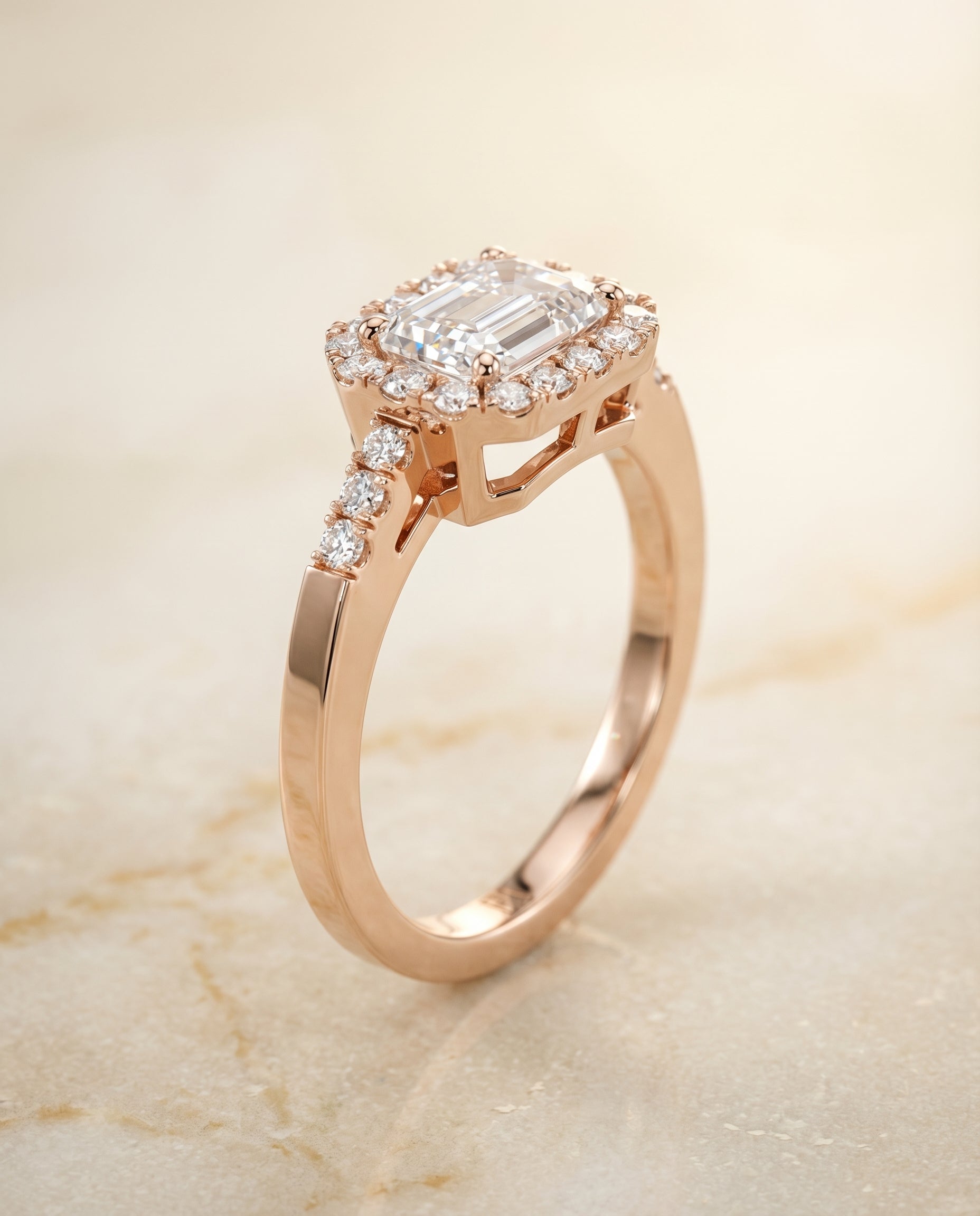Crimson Select East West Horizontal Halo Emerald Cut Lab Diamond Engagement Ring in 14K Rose Gold, front view | RockHer