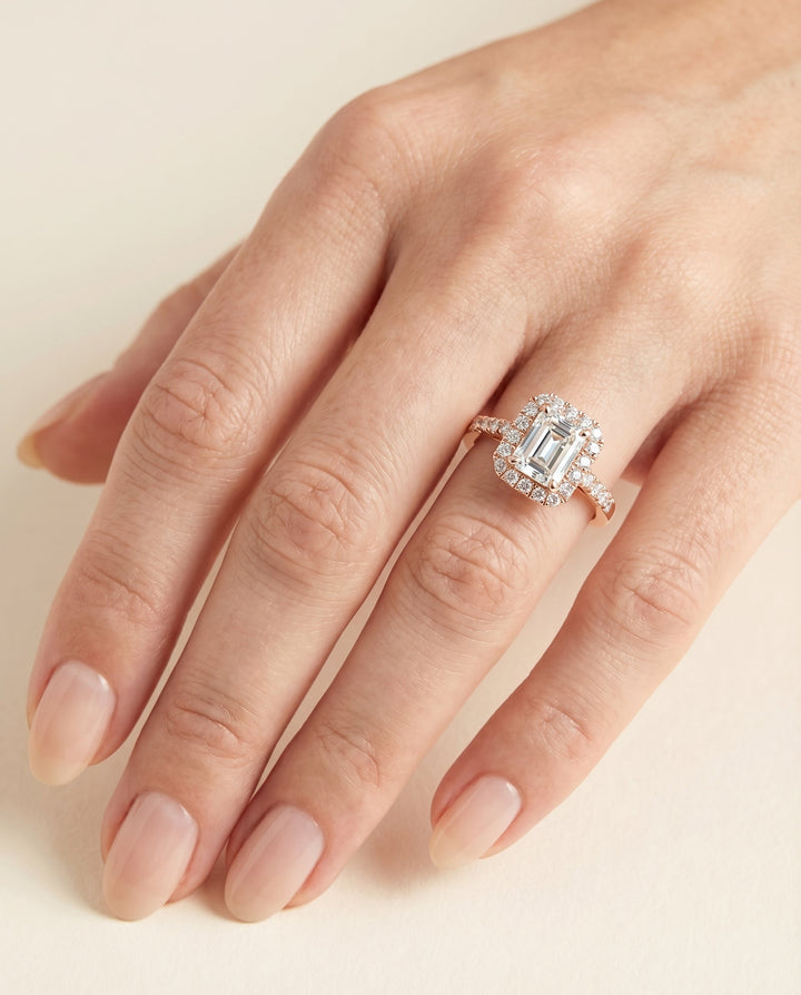 Crimson Select east west horizontal halo emerald cut emerald cut ring in 14K Rose Gold — front — RockHer
