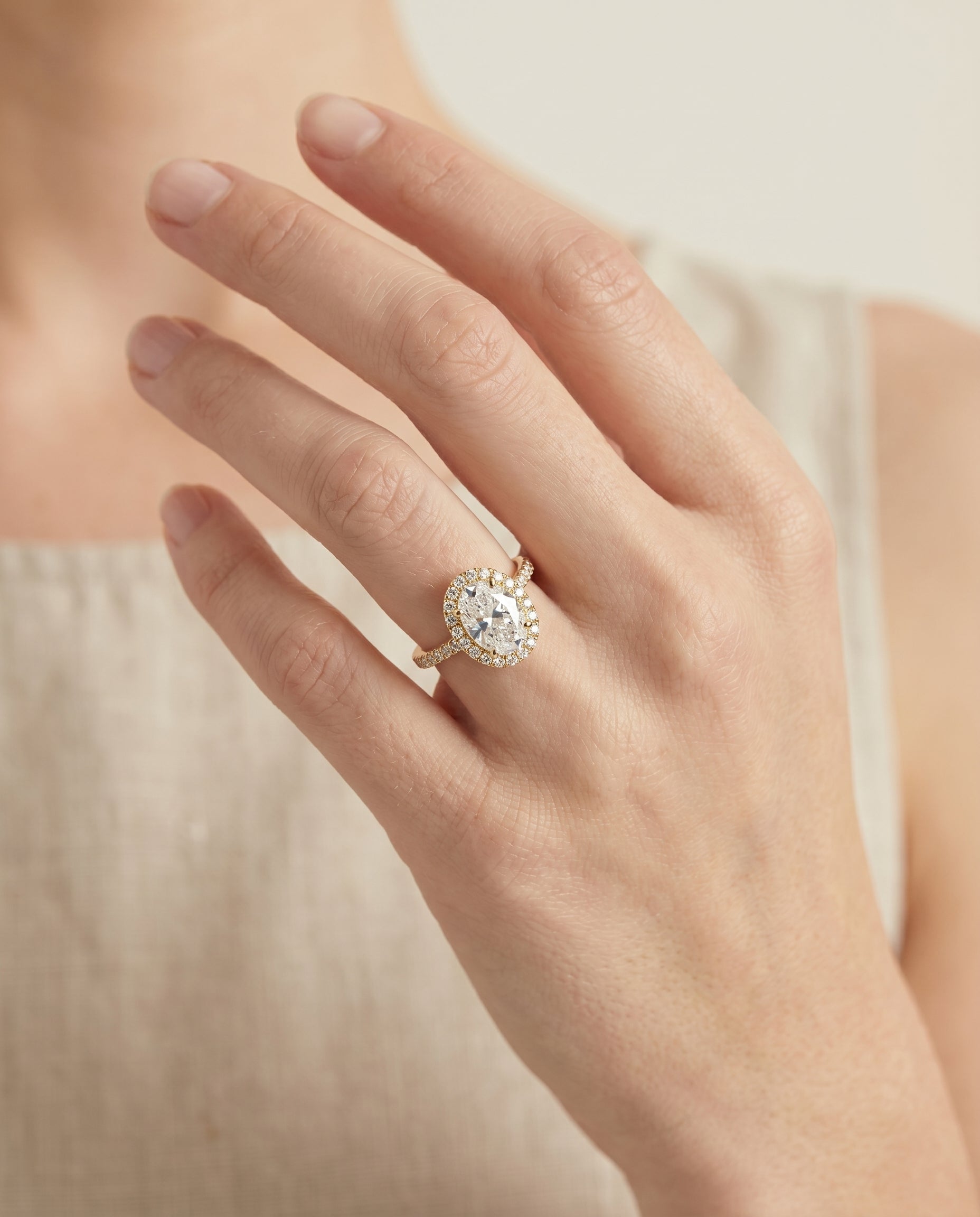 Christina Select East West Horizontal Halo Oval Lab Diamond Engagement Ring in 18K Yellow Gold, shown on hand | RockHer