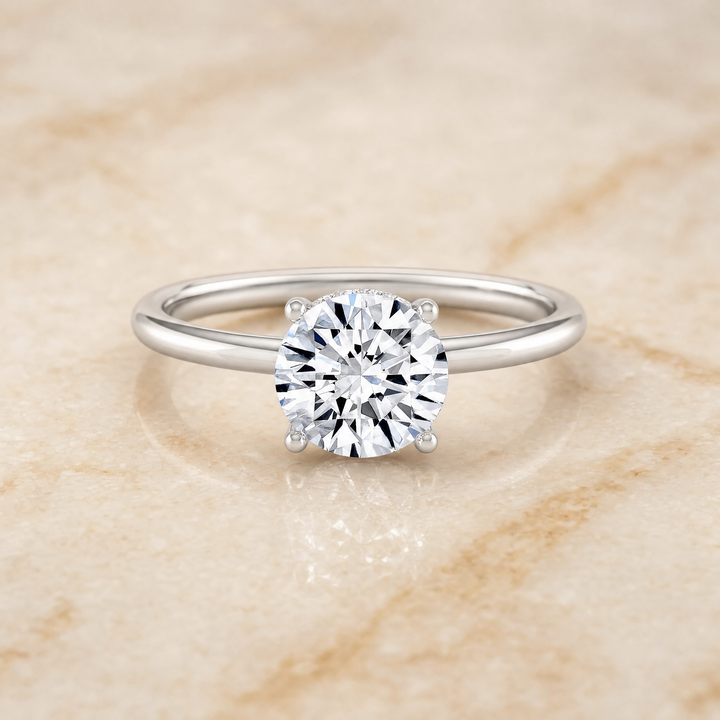 The Eartha Upper Hidden Halo Solitaire Round Engagement Ring Setting in Platinum