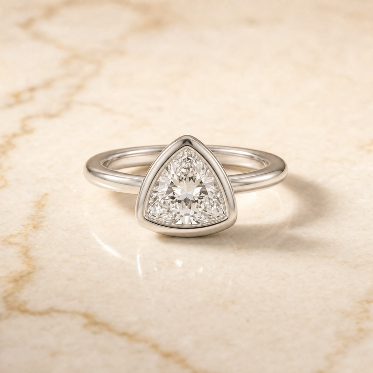 The Agnes Bezel Solitaire In Trillion Engagement Ring Setting in 18K White Gold