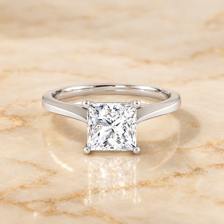 The Elena Timeless Graduated Beveled Shank Solitaire Princess Cut Engagement Ring Setting in Platinum