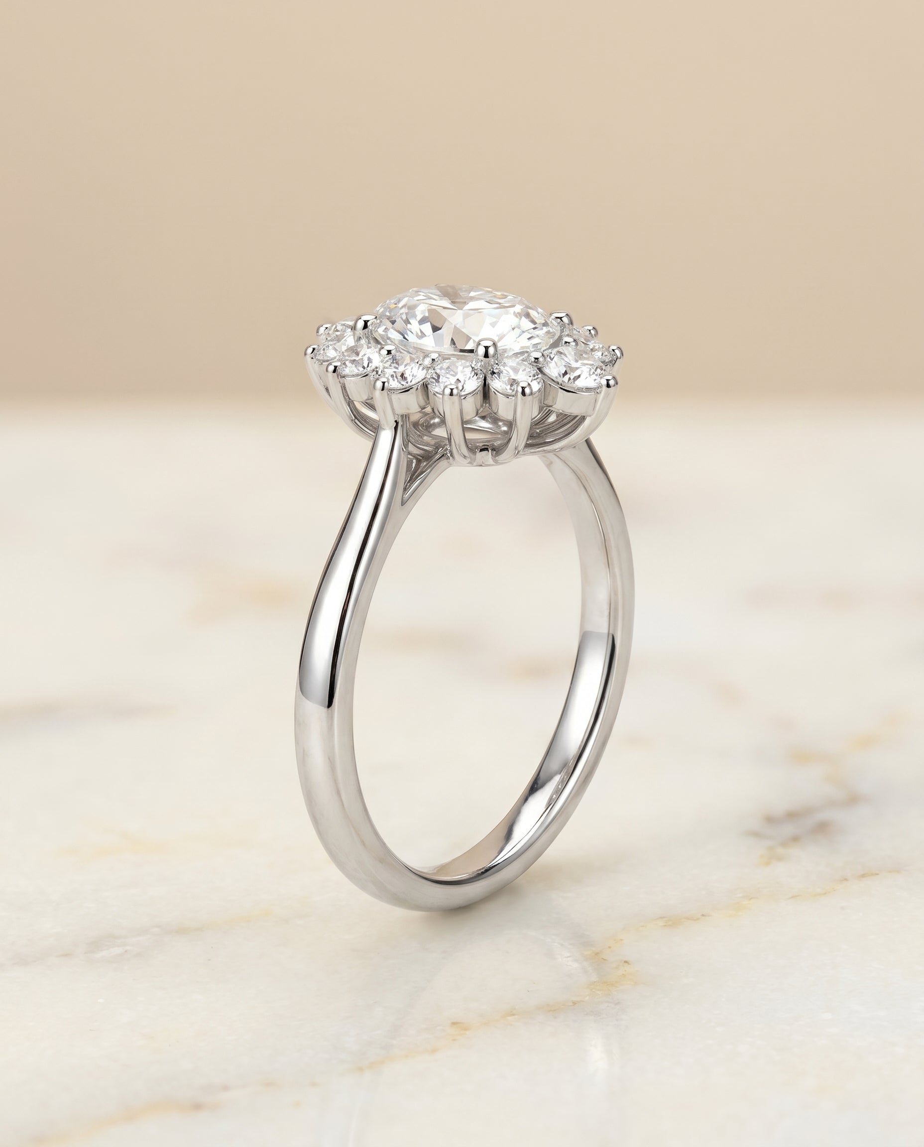 The Eloise floral halo engagement ring setting, shown in Platinum | RockHer