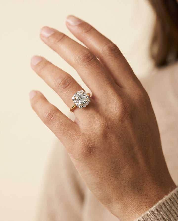 Guthrie Select Floral Prong Halo Cushion Cut Lab Diamond Engagement Ring in 14K Yellow Gold, shown on hand | RockHer