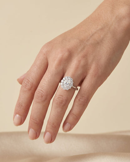 Faith Select Floral Prong Halo Oval Lab Diamond Engagement Ring in 14K White Gold, shown on hand, angled | RockHer