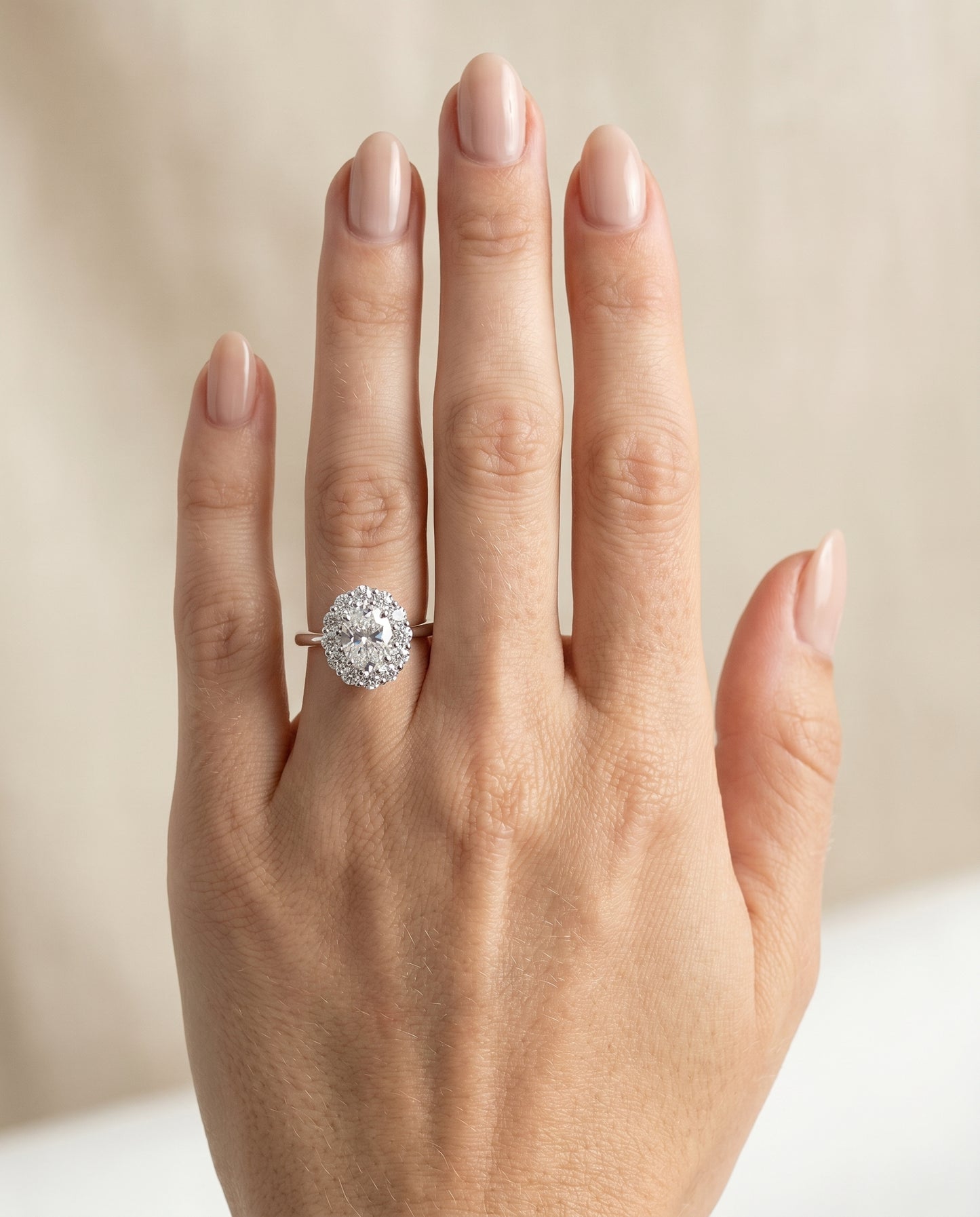 Floral Prong Halo Oval, in Platinum – lifestyle shot | RockHer