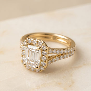 The Lira French Pavé Split Shank Halo Emerald Cut Engagement Ring Setting in 18K Yellow Gold