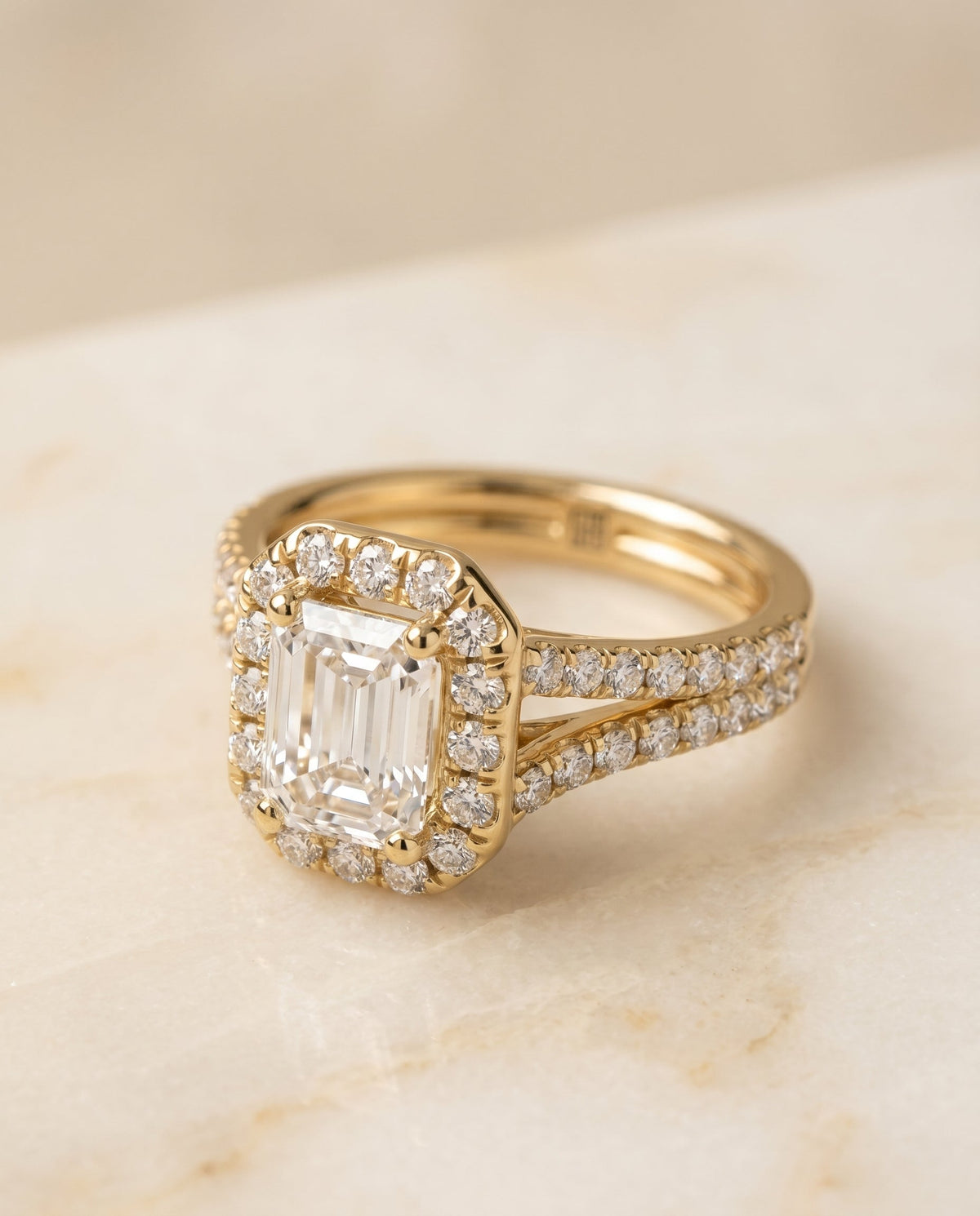 Lira Select Pav Halo Split Shank Emerald Cut Lab Diamond Engagement Ring in 18K Yellow Gold, alternate angle | RockHer