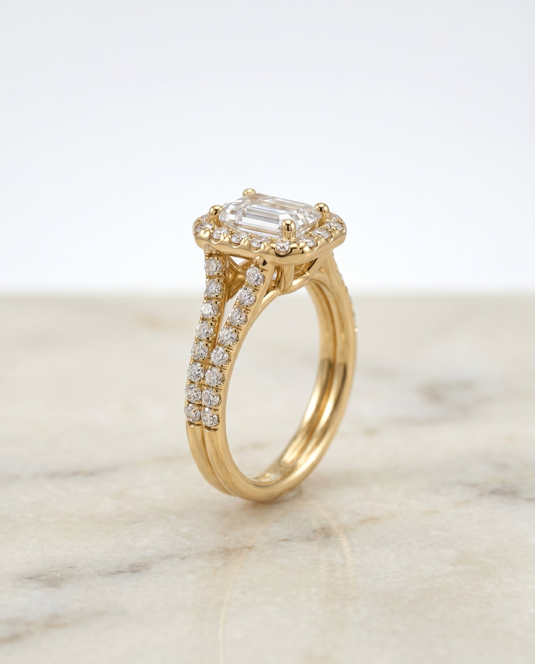 French Pavé Split Shank Halo Cut styling on The Lira emerald engagement ring setting | RockHer