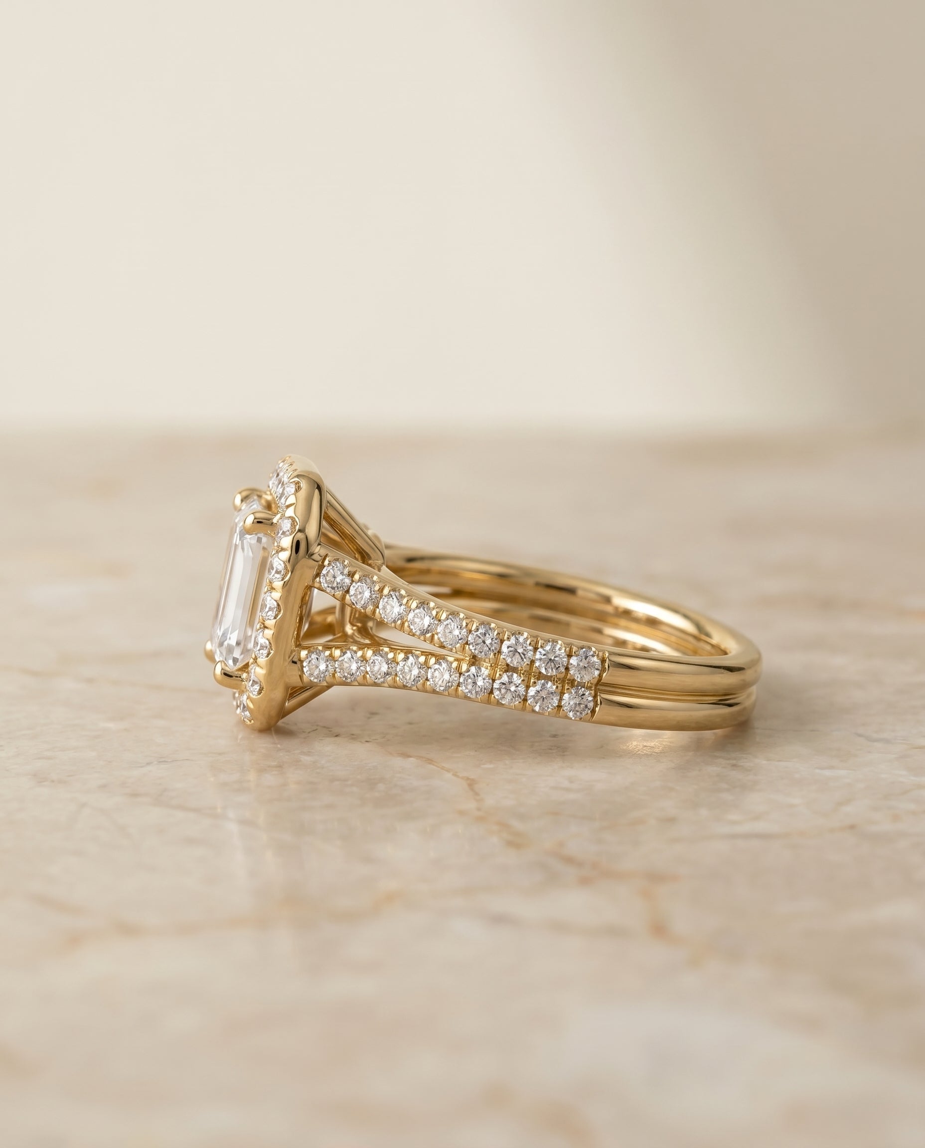 Lira Select Pav Halo Split Shank Emerald Cut Lab Diamond Engagement Ring in 18K Yellow Gold, side view | RockHer
