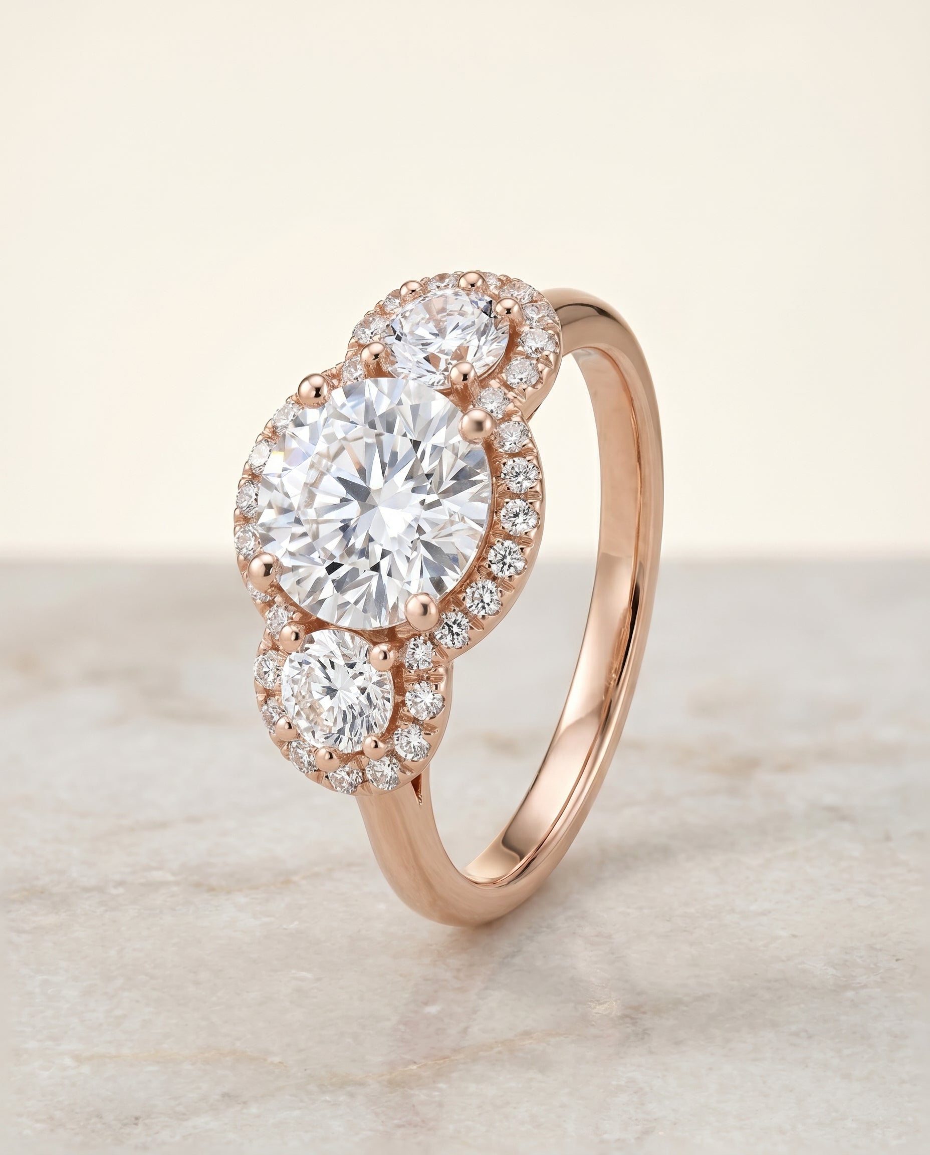 Anna Select Three Stone Halo Round Lab Diamond Engagement Ring in 14K Rose Gold, alternate angle | RockHer