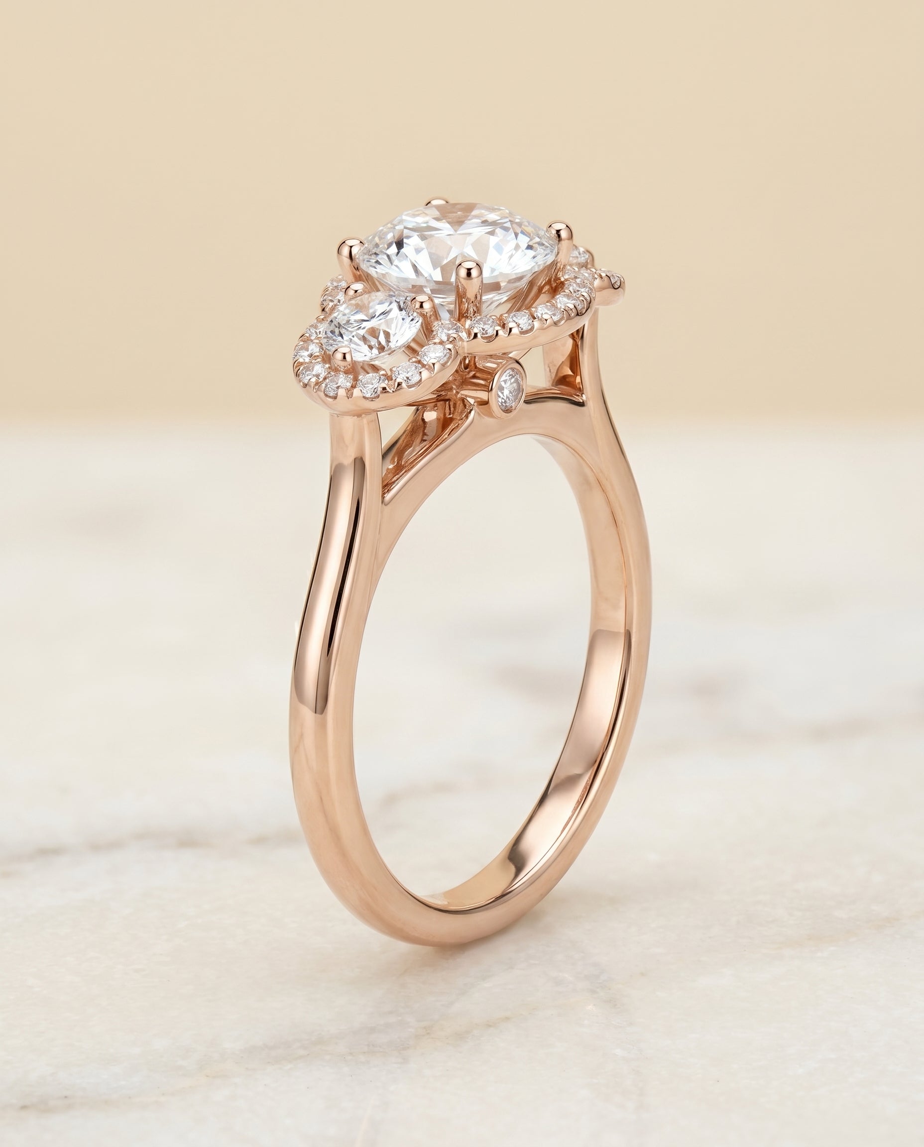 Round Brilliant, French Pavé Three Stone, in 14K Rose Gold, prong setting – front view | RockHer