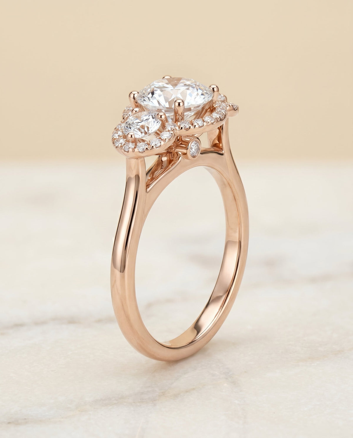 Anna Select Three Stone Halo Round Lab Diamond Engagement Ring in 14K Rose Gold, front view | RockHer