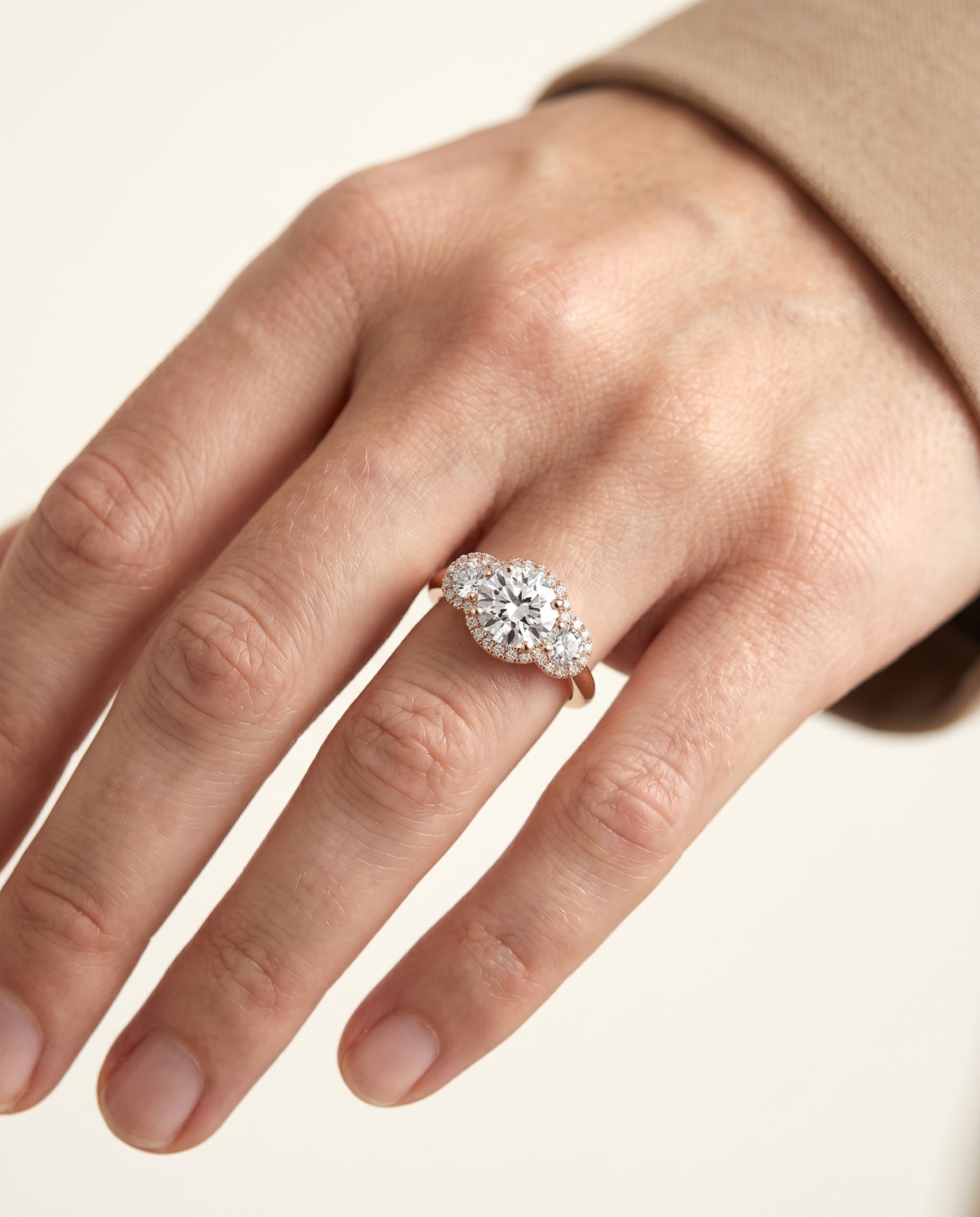 The Anna engagement ring setting in 14K Rose Gold, three stone halo design | RockHer
