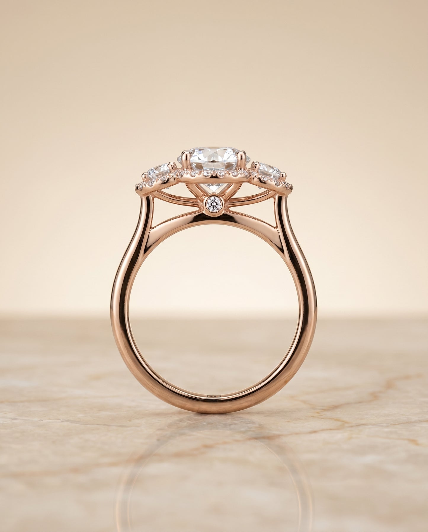 Round Brilliant, French Pavé Three Stone, in 14K Rose Gold, prong setting – side profile | RockHer