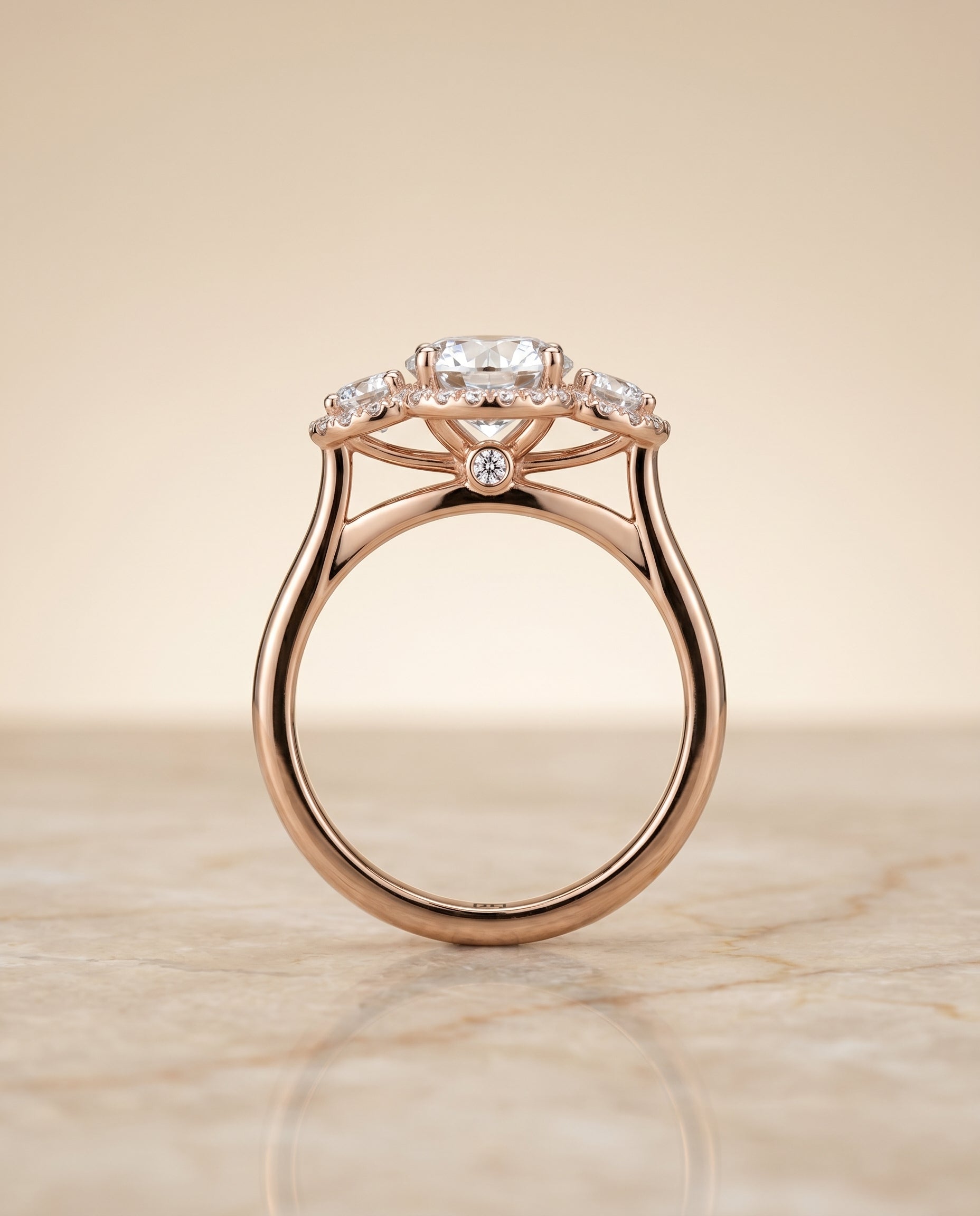 The Anna three stone halo engagement ring setting, shown in 14K Rose Gold | RockHer