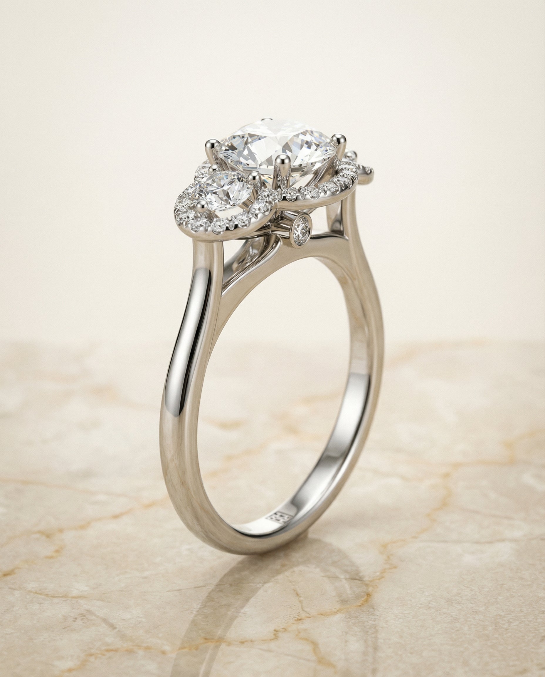 Three Stone Halo styling on The Anna round engagement ring setting | RockHer
