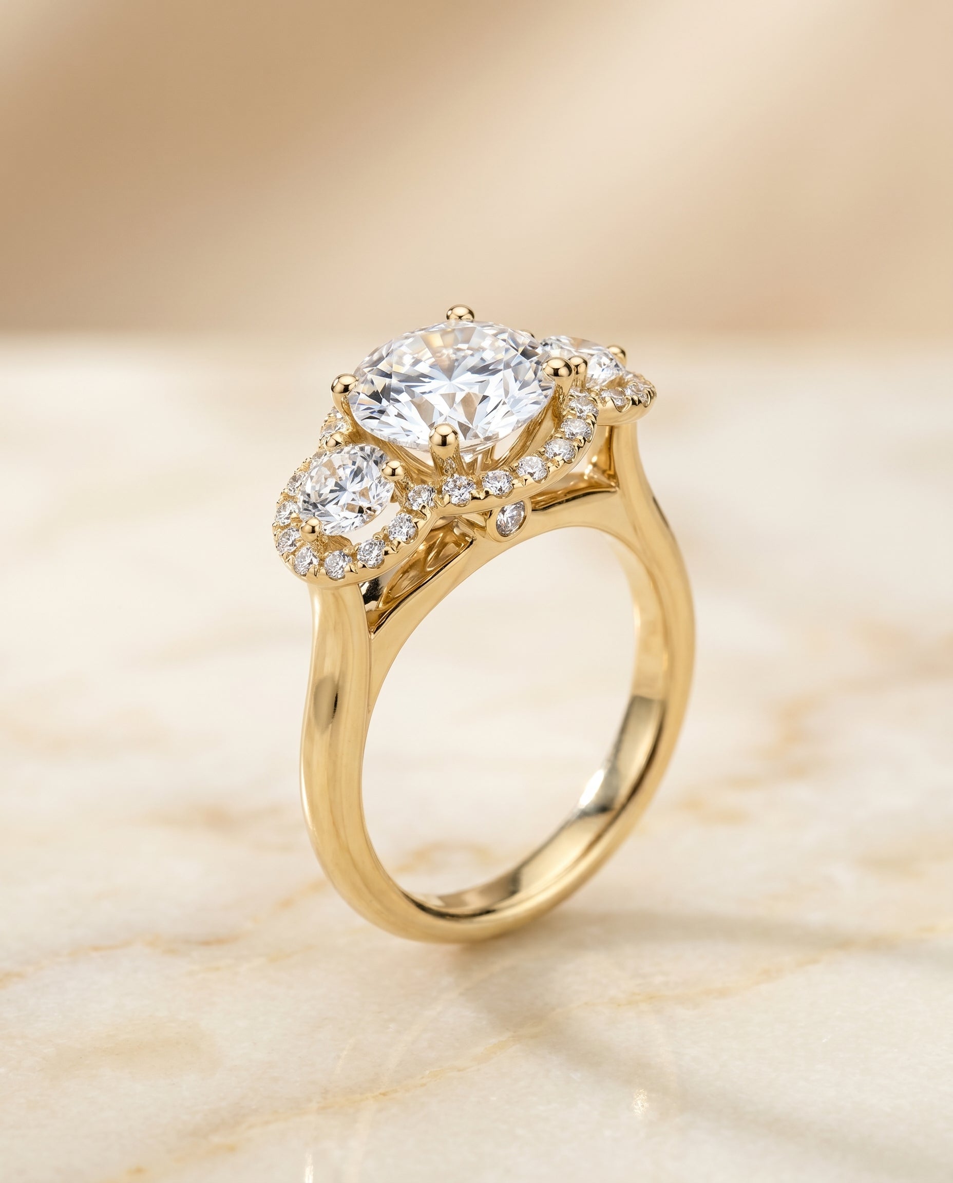 Three Stone Halo styling on The Anna round engagement ring setting | RockHer
