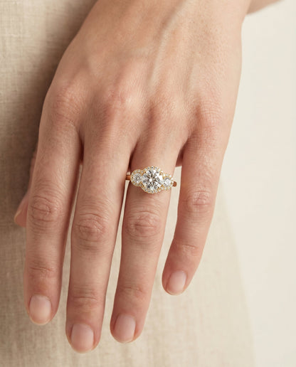Anna Select Three Stone Halo Round Lab Diamond Engagement Ring in 14K Yellow Gold, shown on hand | RockHer