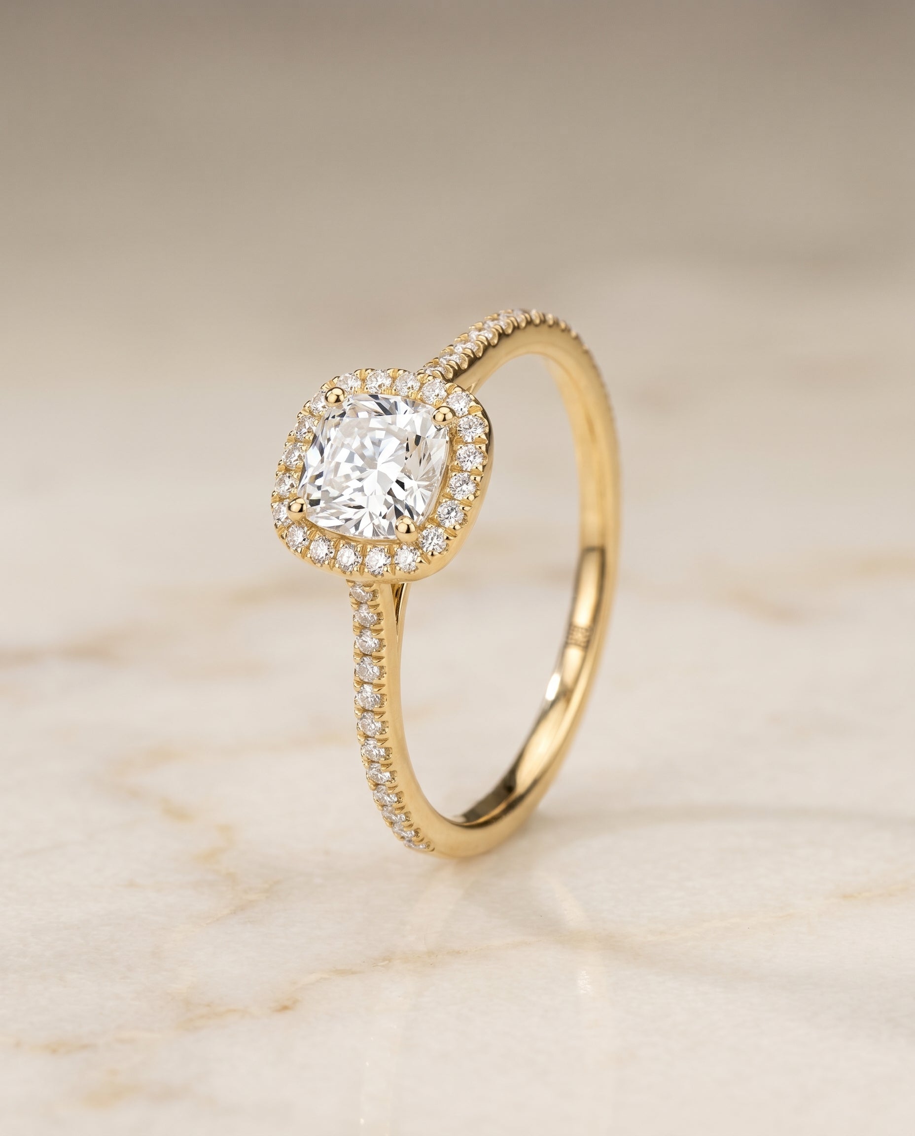 Graduated Shank Pavé Halo Cut styling on The Sonata cushion engagement ring setting | RockHer