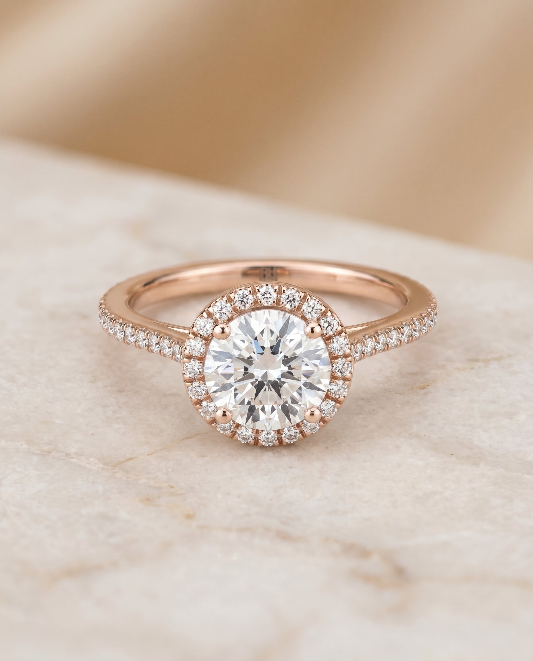 Round Brilliant, Graduated Shank Pavé Halo, in 14K Rose Gold, pave setting – angled view | RockHer