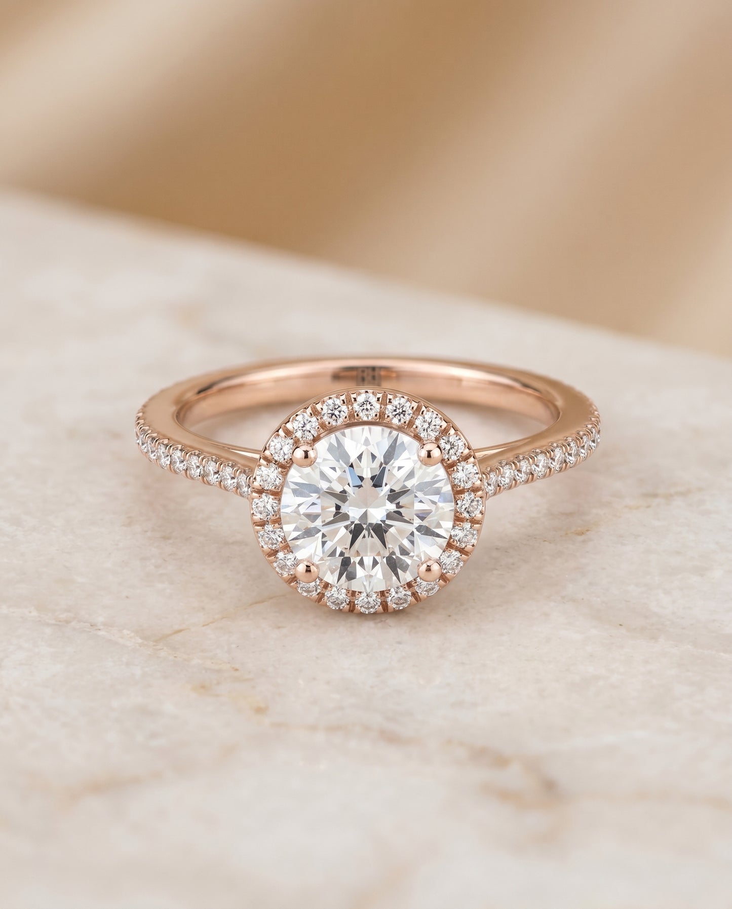 Round Brilliant, Graduated Shank Pavé Halo, in 14K Rose Gold, pave setting – angled view | RockHer