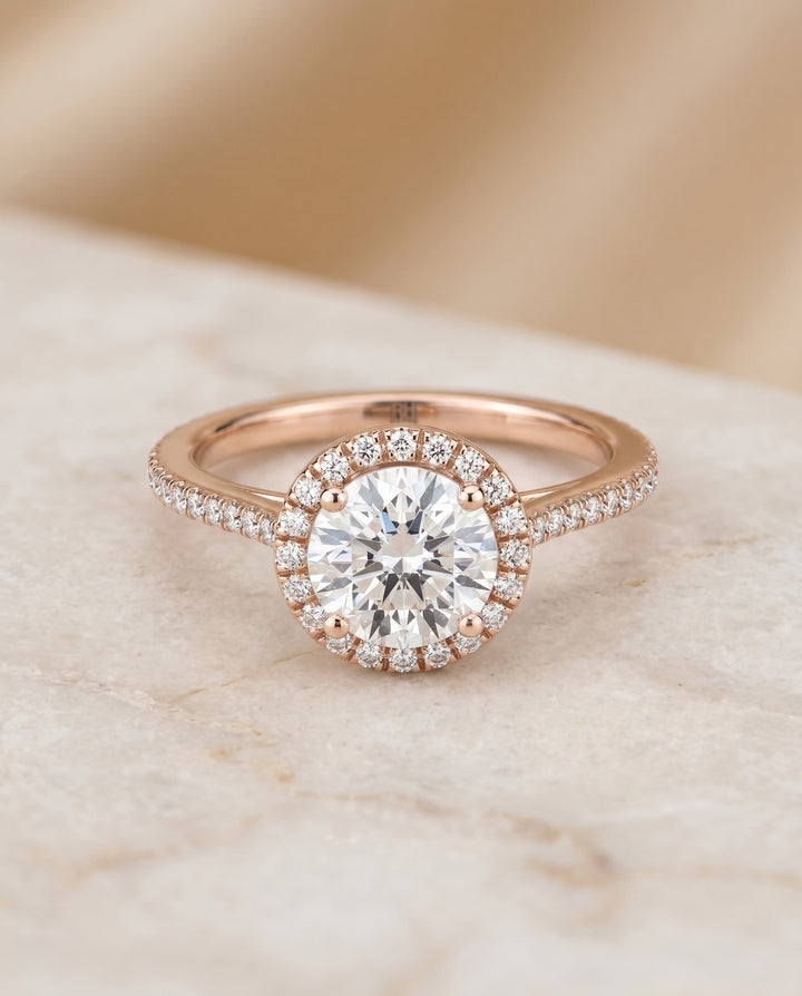 Round Brilliant, Graduated Shank Pavé Halo, in 14K Rose Gold, pave setting – angled view | RockHer