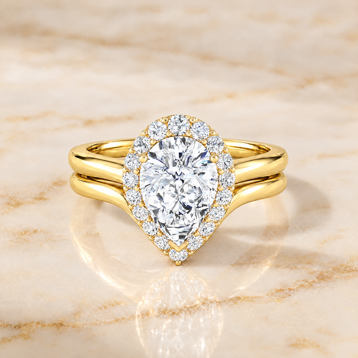 Etta matching wedding band in 18K yellow gold stacked beneath the Etta pear halo engagement ring | RockHer